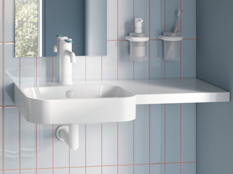 HEWI Fittings AQ Washbasin Accessible toilet with a wall-mounted WC, a hinged support rail and a washbasin with a mirrored cabinet in the bathroom
