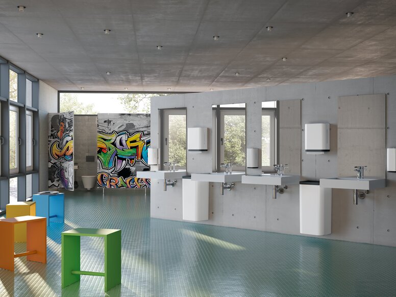 Four wall-mounted washbasins, each with a tap and a mirror, in a public WC