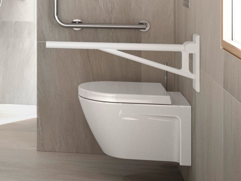 Accessibility WC facilities with a stool by the wheelchair-accessible washbasin, a hinged seat in the shower and a hinged support rail by the toilet