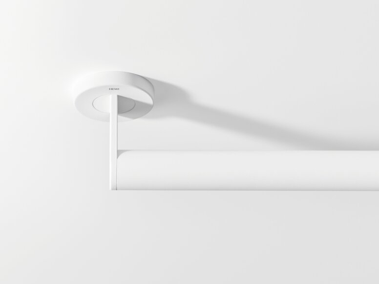 HEWI System 900 support rail White support rail with a tubular grip and round wall mounting against a white background, viewed from above